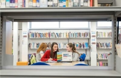 Two petroc students studying in the library