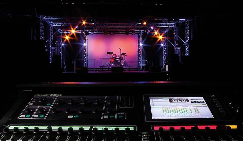 An image of the stage area and soundboard at The Factory