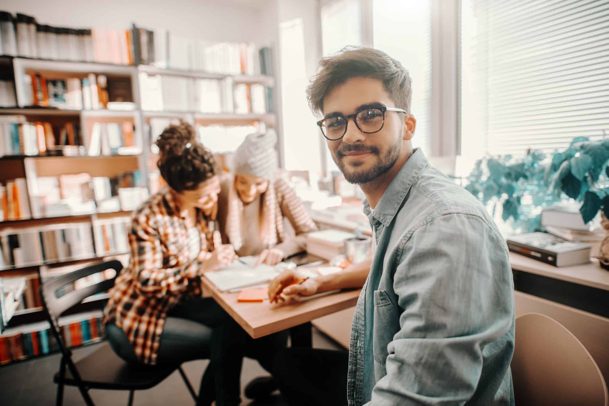 Some students studying in a library