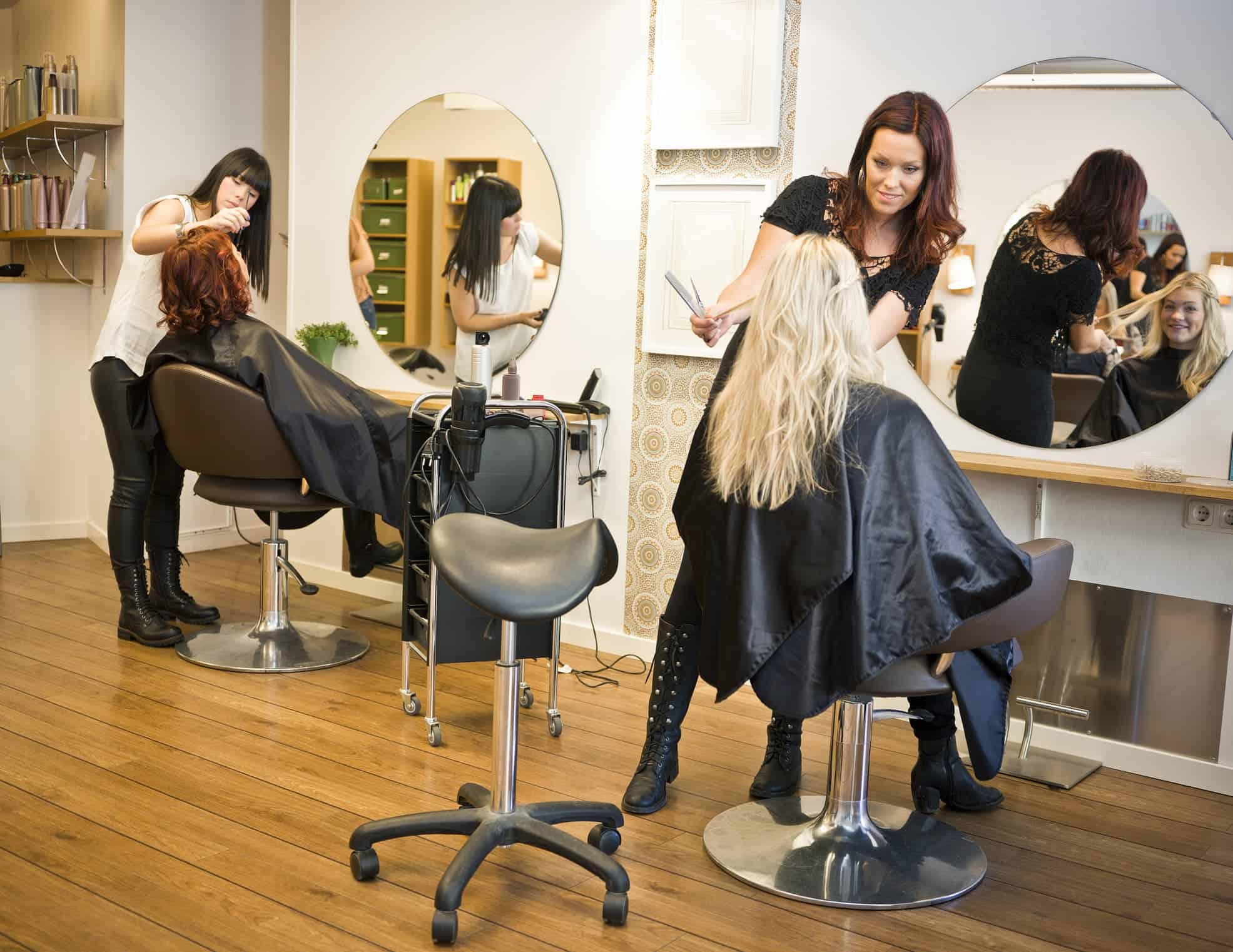 Hair stylists working in a salon