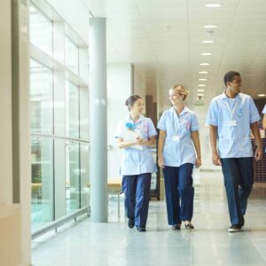 A group of nursing students walking down a corridor