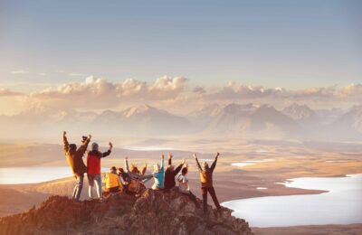 Large group of happy friends in mountains area