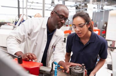 Engineer demonstrating to a work experience student