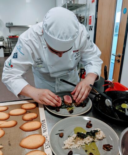 Hospitality and catering students preparing food in the Taw Restaurant