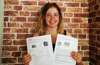 Petroc A-level learner showcasing her results