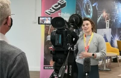 NCS staff member talks to the camera for a TV appearence