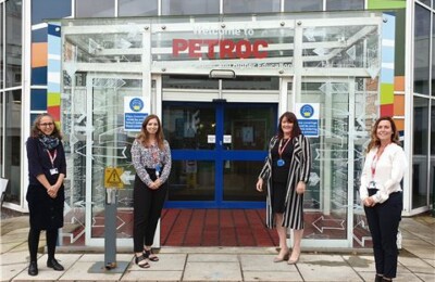 Petroc staff members stood outside the front entrance