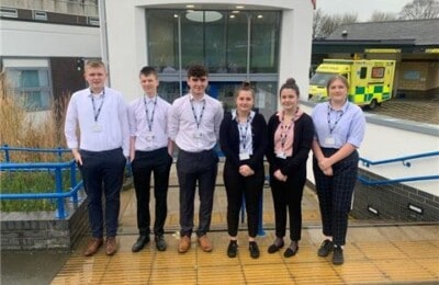 Petroc students standing outside the hospital