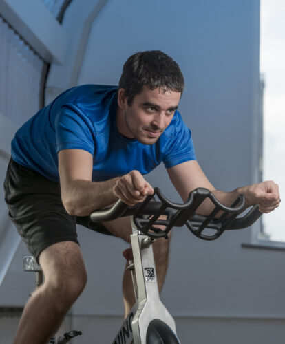 A petroc student using a spin bike