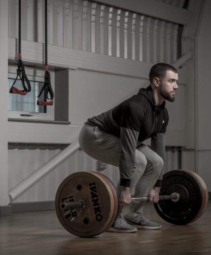 A petroc student lifting weights