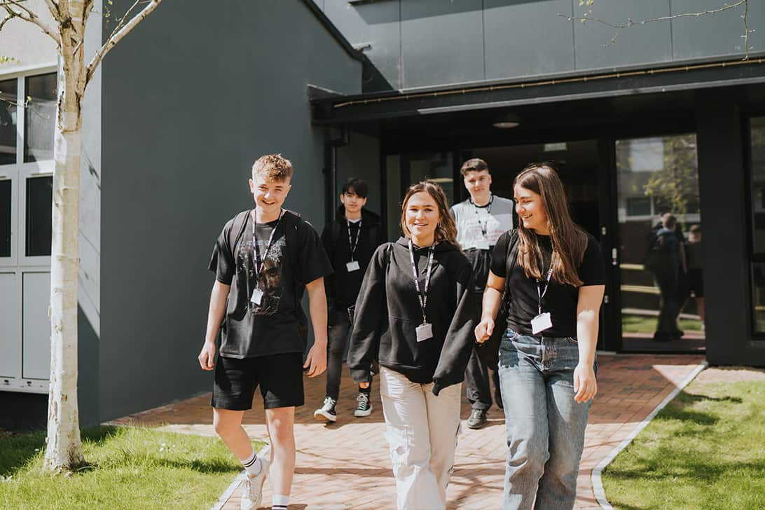 Petroc Students Smiling and walking outside campus