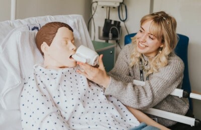 A student with a patient in our sim suite