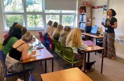 Lecturer teaching a class of college students