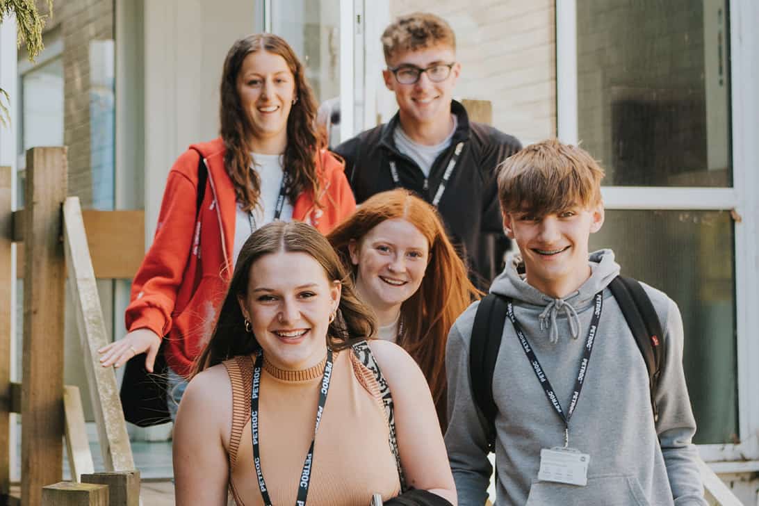 Group of Petroc students smiling at the camera