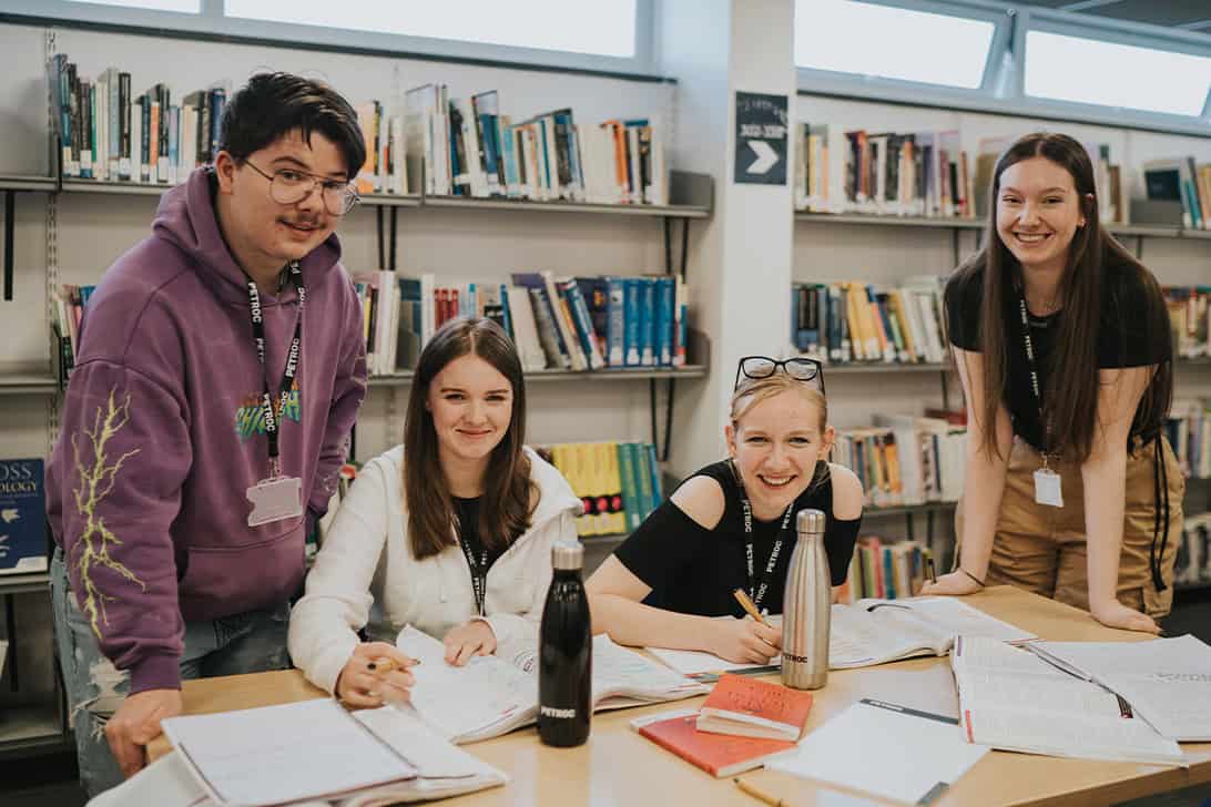 A Level Language students gathered around a desk