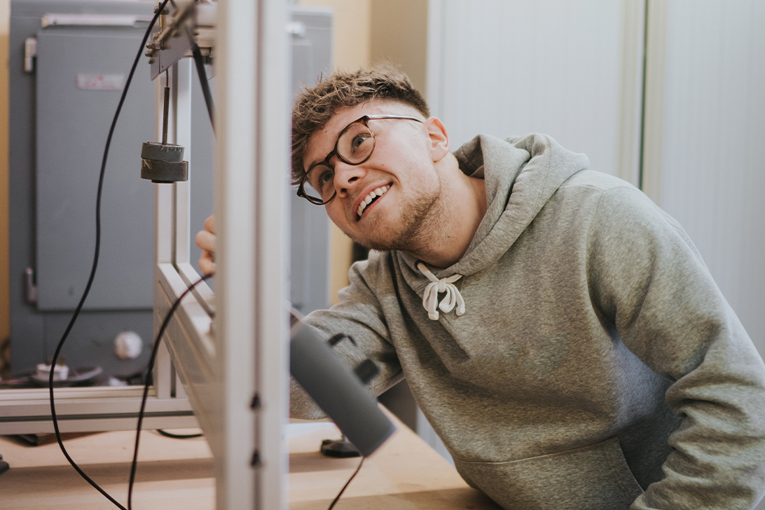 Young man working on construction equipment