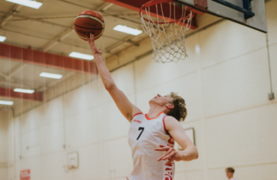 Web Homepage Acadamies Student playing basketball