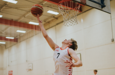 Student playing basketball